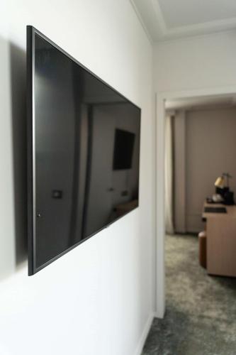 Μια τηλεόραση ή/και κέντρο ψυχαγωγίας στο Best Western Premier Le Masq Hotel