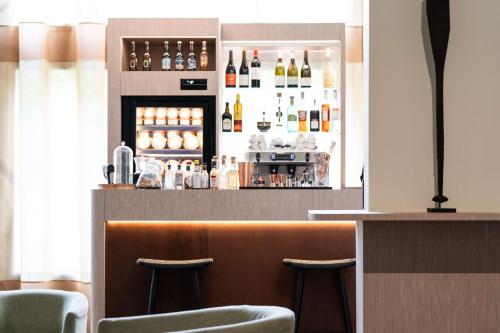 Ο χώρος του lounge ή του μπαρ στο Best Western Premier Le Masq Hotel