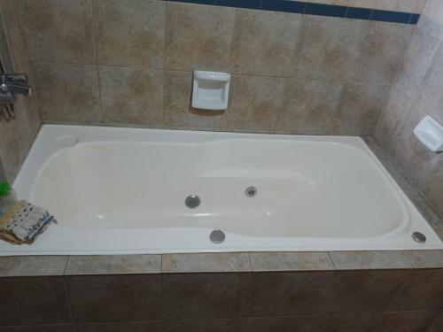 a large white bath tub in a bathroom at Casa Blanca in San Carlos de Bariloche