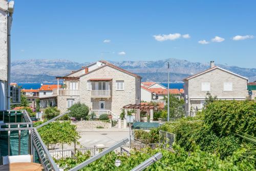 a view from the balcony of a house at Double Room Supetar 5658d in Supetar