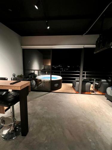 a living room with a tub in the middle of a room at Eco Lodge Glamping in Guatapé