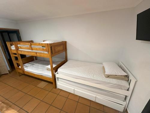a room with two bunk beds in a room at 1770 Holiday Village in Seventeen Seventy