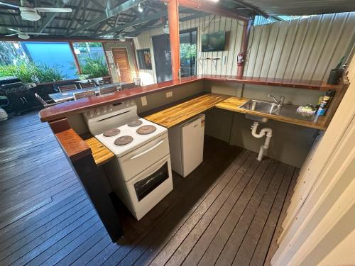 a kitchen with a stove and a sink at 1770 Holiday Village in Seventeen Seventy