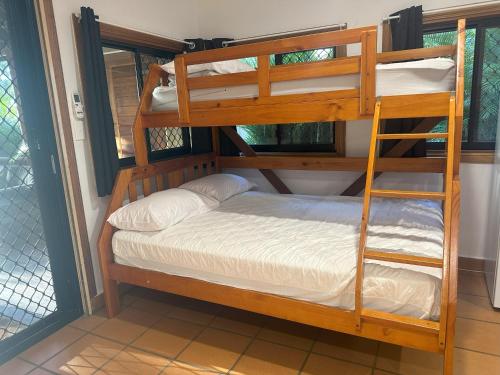 a bunk bed in a room with a bunk bed in a house at 1770 Holiday Village in Seventeen Seventy