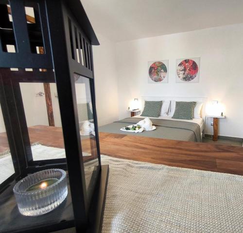 a bedroom with a bed and a mirror at Casa vacanze green house in Terrasini