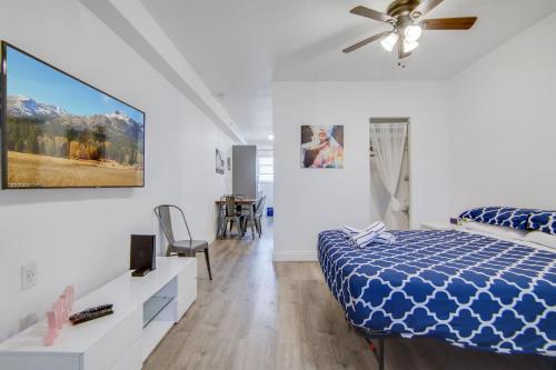 a bedroom with a bed and a ceiling fan at Private Ocean Dr Apt w/2 Queen Beds, Steps 2 Beach in Miami Beach
