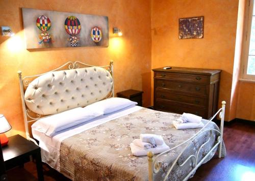 Postel nebo postele na pokoji v ubytování L'Antico Granaio Paliano