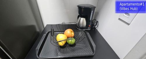 a basket of fruit sitting on top of a counter at Copacabana Vibes Studios in Rio de Janeiro