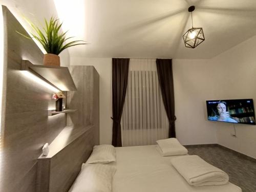 Ліжко або ліжка в номері Apartament ultracentral