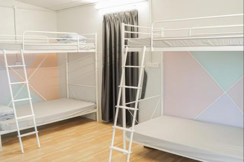 Una cama o camas en una habitación de Trang Trại Gia Trịnh