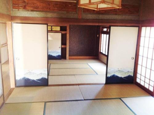 a room with sliding doors in a room with at 峰-Mine in Omachi