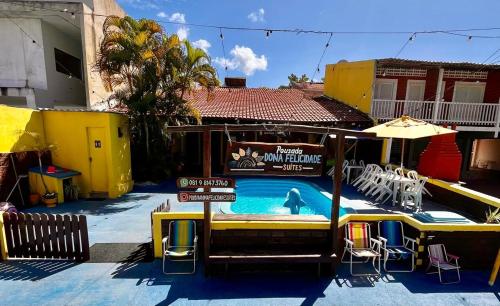 a swimming pool with a polar bear in it at Pousada Dona Felicidade Carneiros in Tamandaré
