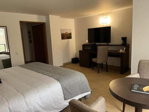 Postel nebo postele na pokoji v ubytování Hotel Parque 97 Suites