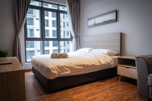 a bedroom with a bed and a large window at K Avenue by Pinstay in Donggongon