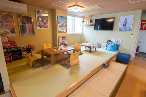 TV a/nebo společenská místnost v ubytování Guesthouse tomoeドットコム