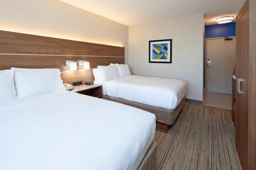 a hotel room with two beds and a desk at Holiday Inn Express Hotel & Suites San Diego-Escondido by IHG in Escondido