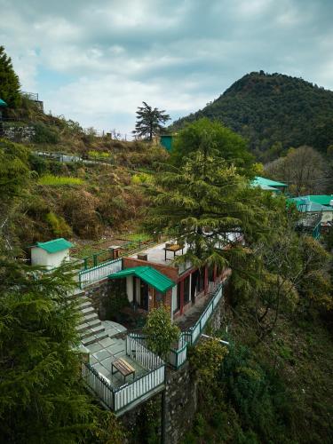 an aerial view of a house on a hill at Seegreen Lodges in Mussoorie