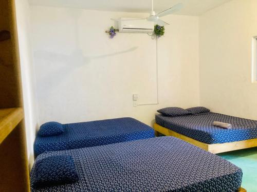 Ένα ή περισσότερα κρεβάτια σε δωμάτιο στο Casa PXM