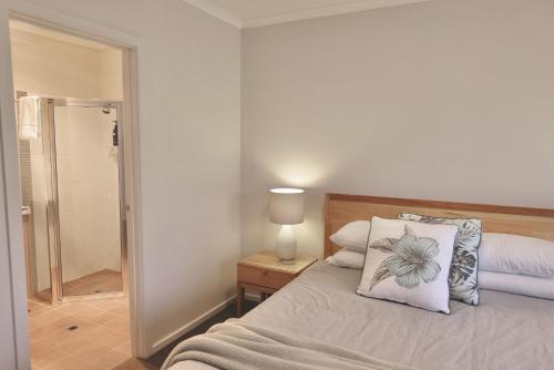 a bedroom with a bed with a pillow on it at Guichen Villa 3 - Wi-Fi Pets welcome outside in Robe