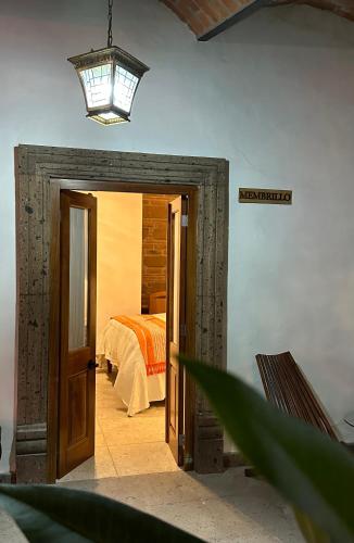 Postel nebo postele na pokoji v ubytování Hotel Casona El Calvario