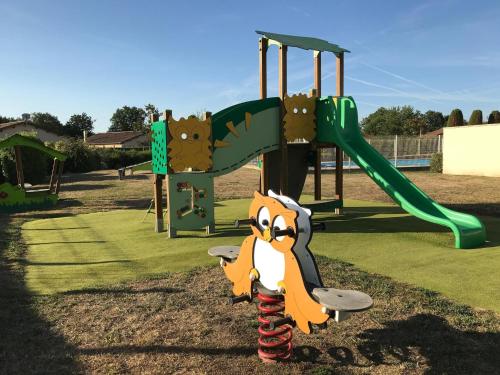 a playground with a monkey toy next to a slide at Villa in Les Forges with Golf & Pool Access in Les Forges