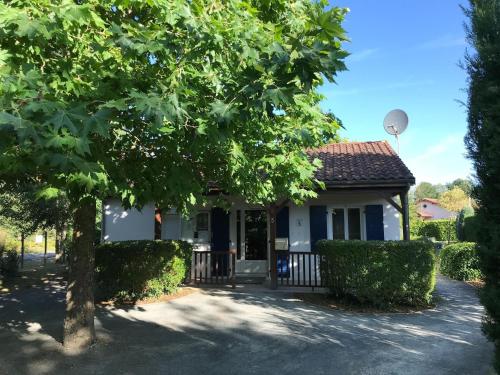 a house with a tree in front of it at Villa in Les Forges with Golf & Pool Access in Les Forges