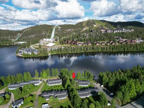 an aerial view of a resort on a lake at Lomakivakka - Roomy 2BD & loft by the lake, free wifi and sauna in Ruka