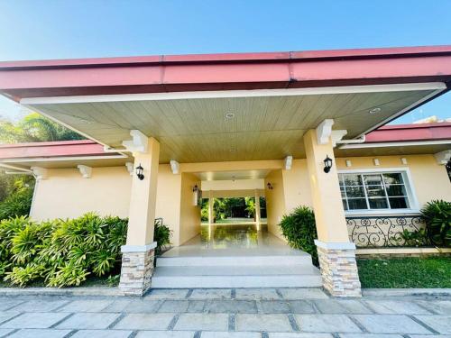 a house with a red roof and a porch at La Prima - The Perfect Urban Oasis in Santa Rosa