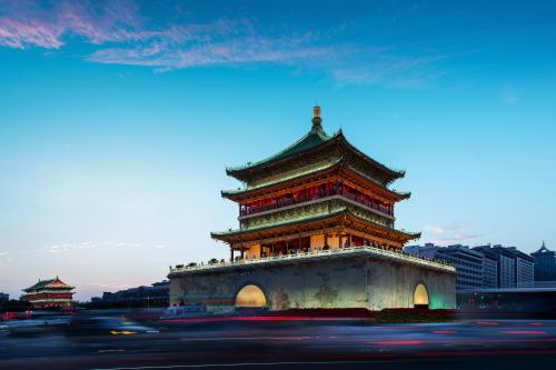 a chinese tower in a city with a street at Empark Grand Hotel Xi'an in Xi'an
