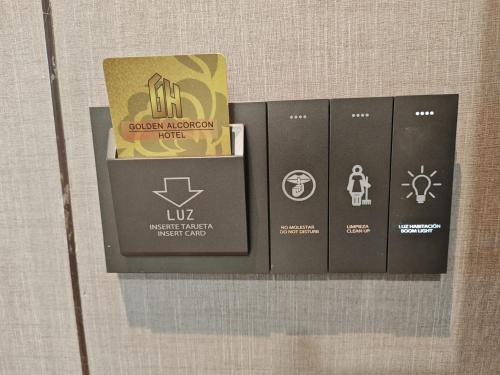 a row of lockers on a wall with a box at Hotel Golden Alcorcon in Alcorcón
