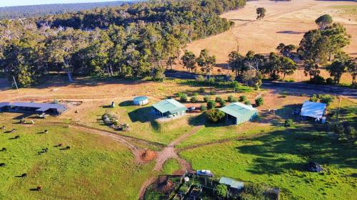 an aerial view of a farm with houses and animals at 2 bedroom farm stay in Metricup at Qwack's Farm in Metricup