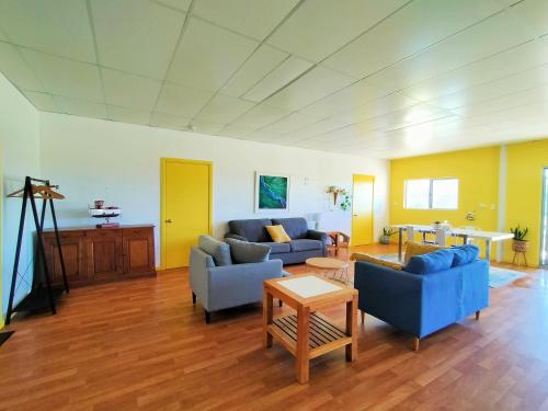 a living room with two blue couches and a table at 2 bedroom farm stay in Metricup at Qwack's Farm in Metricup
