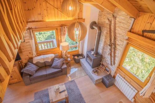 an overhead view of a living room with a fireplace at Chalet avec vue in Nendaz