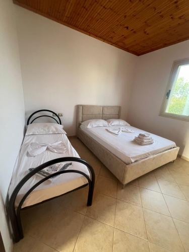 Postel nebo postele na pokoji v ubytování Nori House