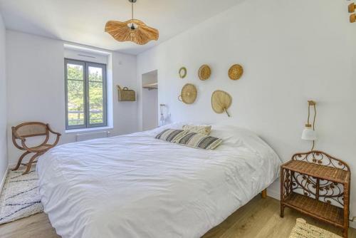 Ein Bett oder Betten in einem Zimmer der Unterkunft Gîte de l'Etoile, maison rénovée à 18min du PuyduFou