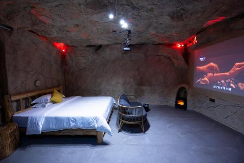 Ein Bett oder Betten in einem Zimmer der Unterkunft Zhangjiajie Guanshan Beiyuan