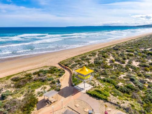 an overhead view of a beach with a yellow structure at Syds Place A 70s retro beach house Free WIFI in Goolwa South