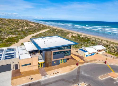 an aerial view of a building on the beach at Syds Place A 70s retro beach house Free WIFI in Goolwa South