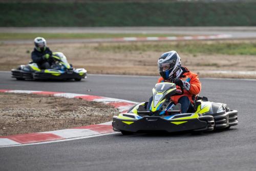 two people riding oncycles on a race track at Sztár Motel Étterem in Balassagyarmat