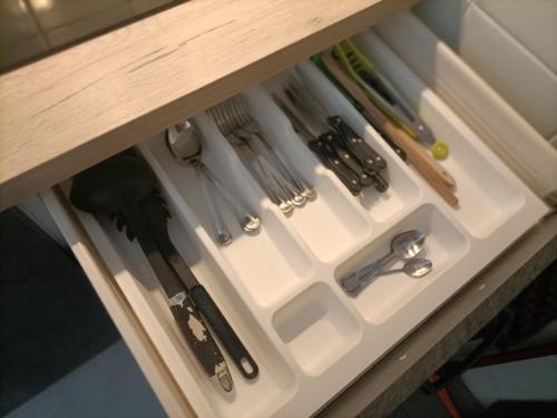 a drawer in a counter with knives and utensils at Casa vacanze Casa Elena in San Giorgio a Cremano