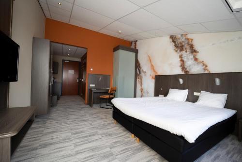 Fletcher Wellness-Hotel Brabant-Millにあるベッド