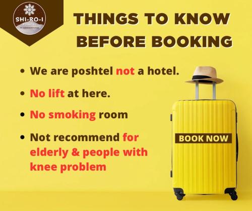 a yellow suitcase with a hat on top of it at Shi-ro-i Poshtel in Hat Yai