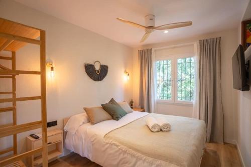 a bedroom with a bed with two towels on it at Picasso Mountain View Begur in Begur