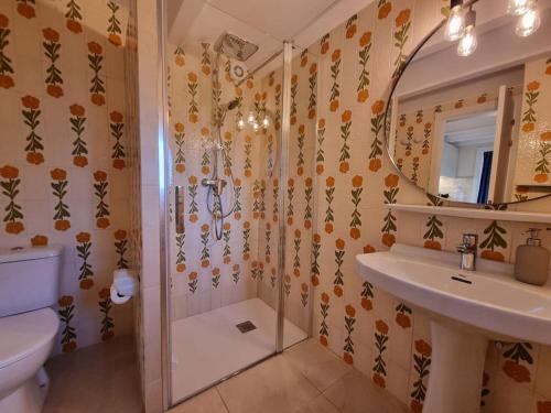 a bathroom with a shower and a sink and a mirror at Picasso Mountain View Begur in Begur