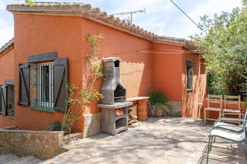 an outdoor oven sitting outside of a house at Picasso Mountain View Begur in Begur