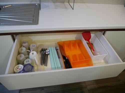 a drawer in a desk with utensils at vivacity megamall jazz suites 2 kuching in Kuching