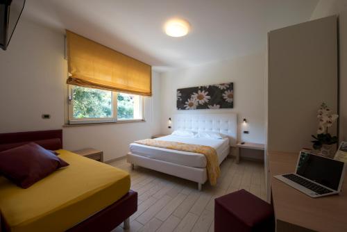 A bed or beds in a room at Il Giardino Sul Mare