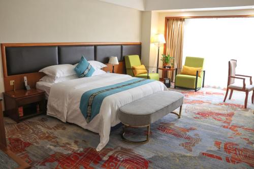 Postel nebo postele na pokoji v ubytování Gladden Hotel Jiangmen