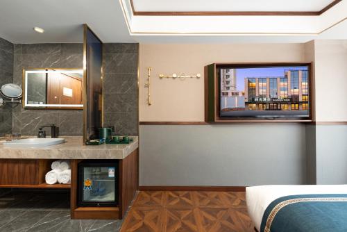 a hotel bathroom with a sink and a mirror at Nost algia S Hotel Beijing Guomao CBD 时光漫步S酒店 北京大望路地铁站店 Free fresh ground coffee,Free laundry service in Beijing