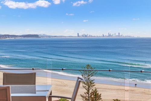 a view of the ocean from a balcony of a beach at 2 bedroom Penthouse Kirra Point no.19 in Gold Coast